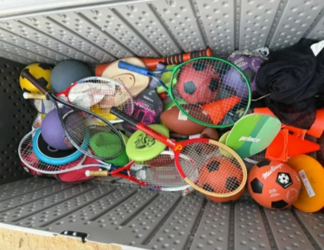 The Sports Stack box full of rackets, balls and frisbees