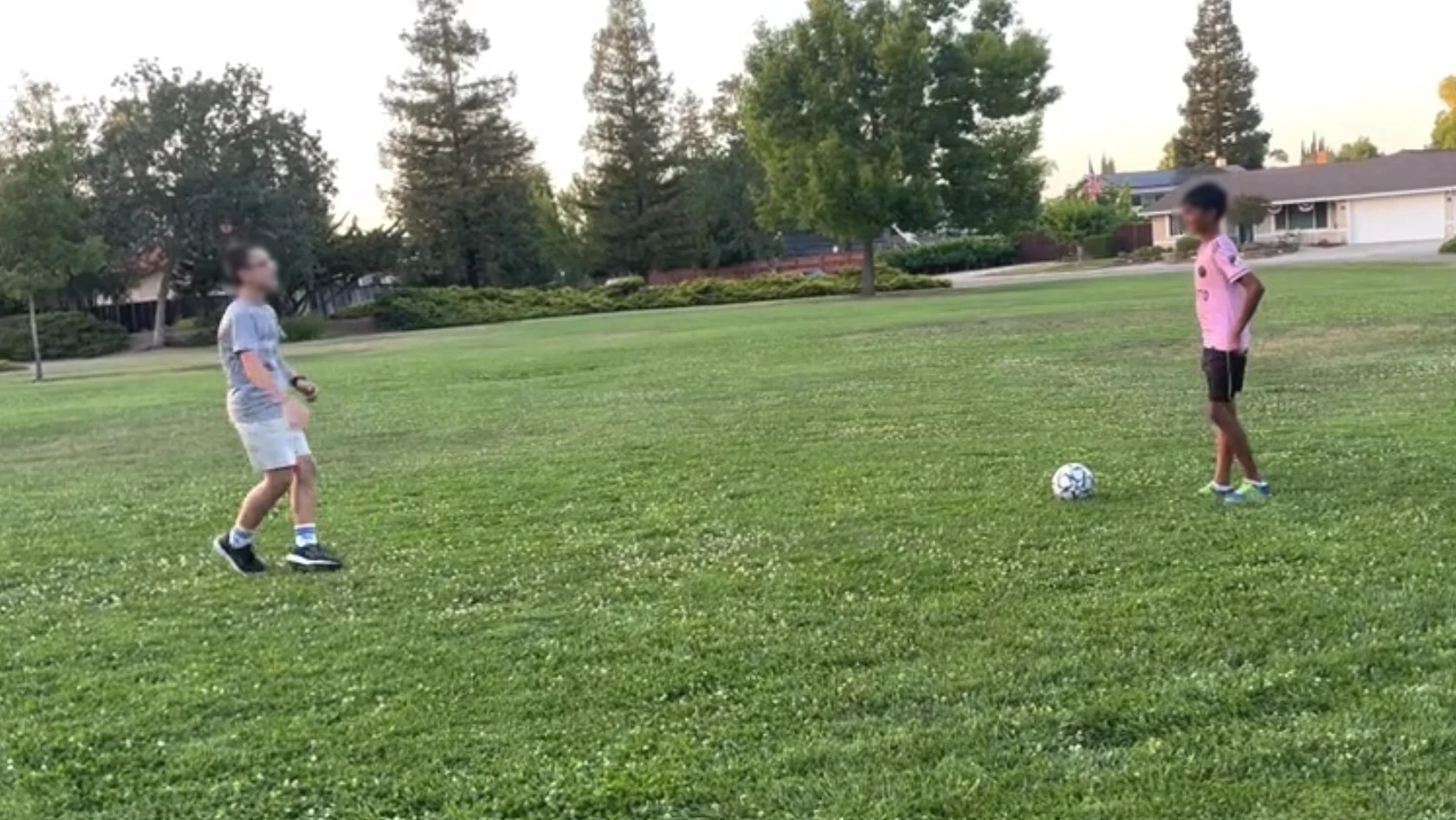 Two kids playing soccer with a ball from Sports Stack