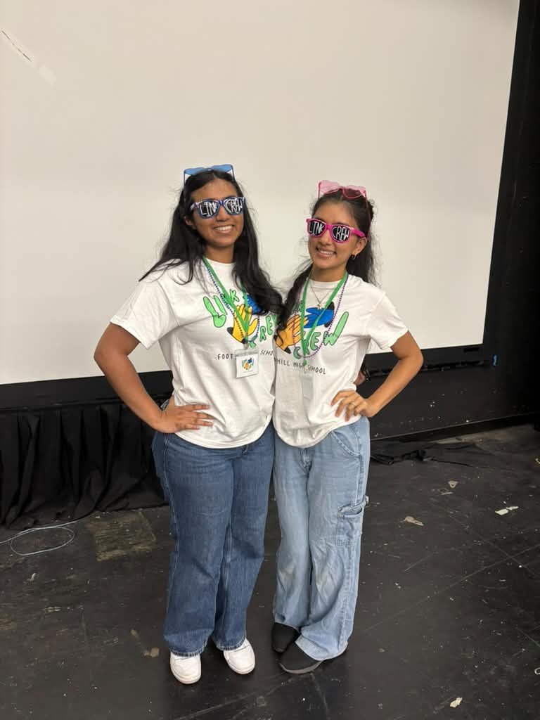 Two Link Crew leaders in matching shirts and Link Crew sunglasses